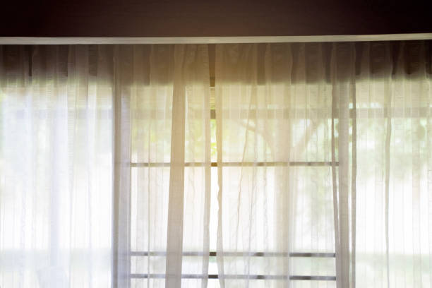 istock White curtain  at the door with light effect background 820807146