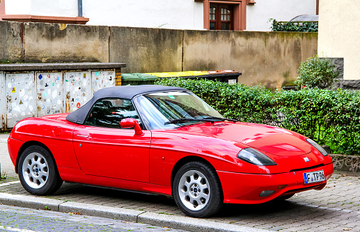 FRANKFURT AM MAIN, GERMANY - SEPTEMBER 15, 2013: Motor car Fiat Barchetta in the city street.