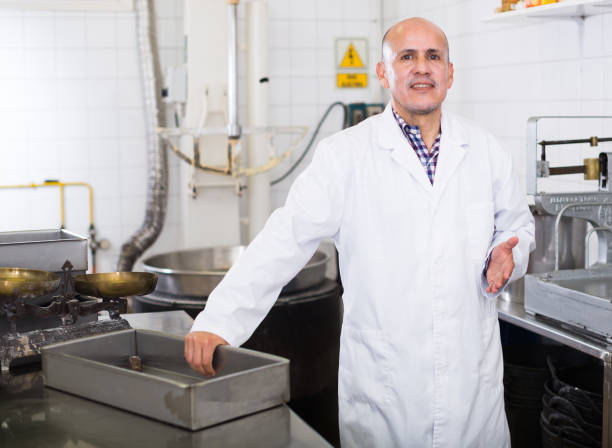 istock Adult male standing in production workshop 820808280