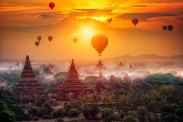 Hot air balloon over plain of Bagan in misty morning, mandalay Myanmar