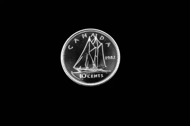 Photo of Old Canadian dime on a black background