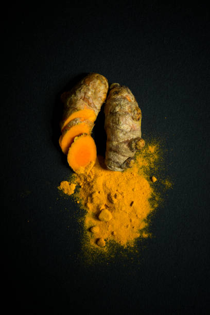 istock Turmeric roots and turmeric powder 820809386