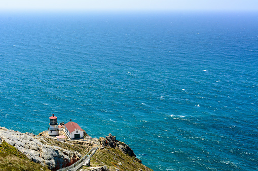The lighthouse at Point Reyes National Seashore overlooking the Pacific Ocean on a summer afternoon
