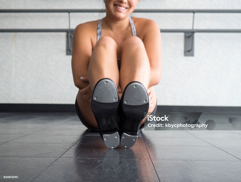 the Happy Tapper Smiling Teenager in tap class showing the bottom of her tap shoes Tap Dancing Stock Photo