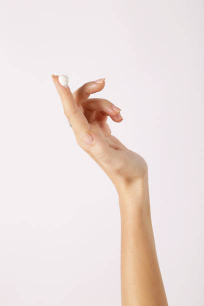 istock Cream on a woman's index finger 820813638