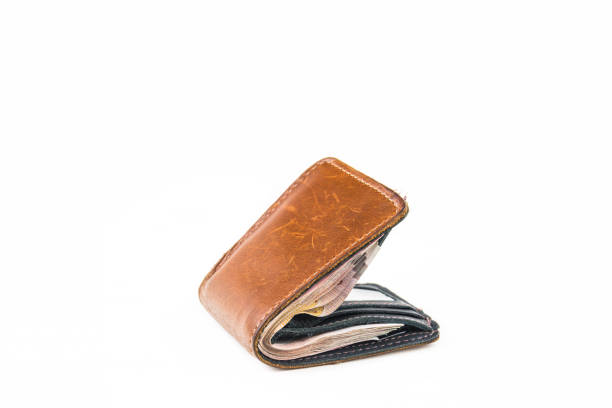 istock leather wallet with money isolated on white background . 820813928