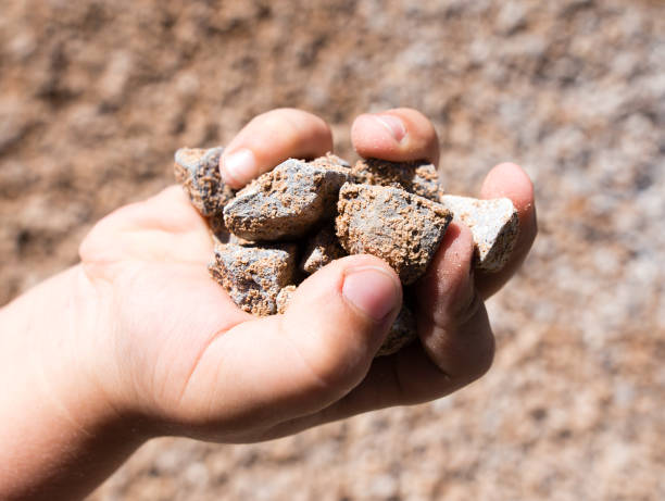 istock Building crushed stone with sand in hand 820814796