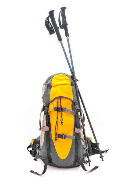 Backpack and equipment for trekking on white background