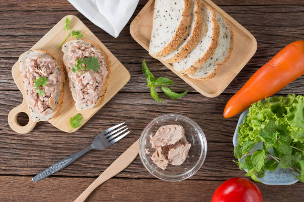 istock Preparing fresh homemade tuna sandwich with sesame bread. 820818396
