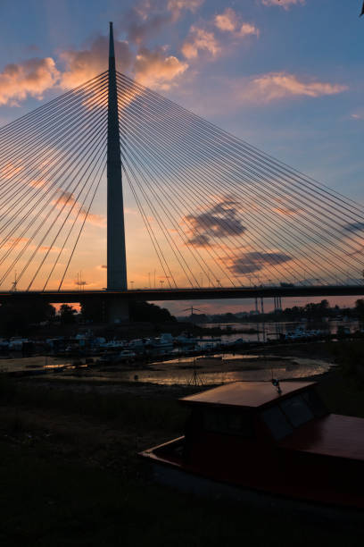 istock Silhouette of a huge cable bridge over Sava river at sunset in Belgrade 820821414