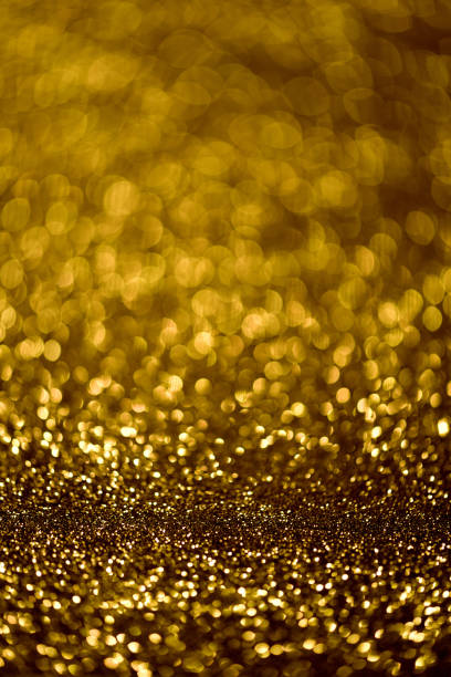 istock Abstract holidays Bokeh lights and gold on background 820821742
