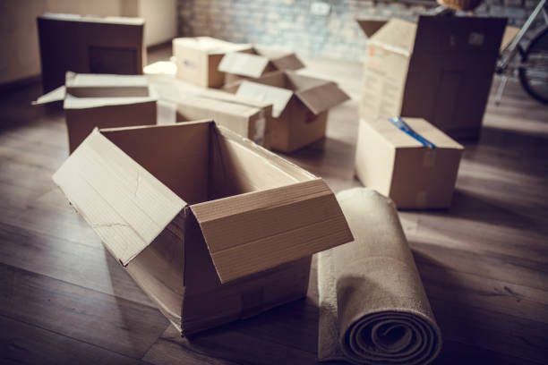 istock Cardboard boxes on the floor in a new apartment. 820821868