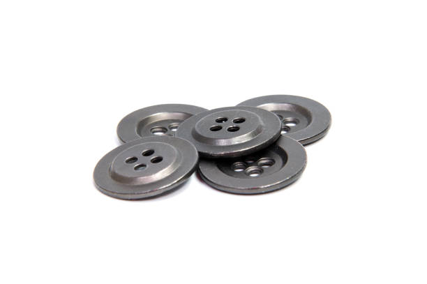 istock Single  clothing button isolated over the brown background 820833556