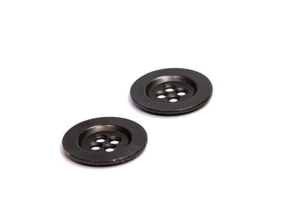 istock Single  clothing button isolated over the brown background 820833750