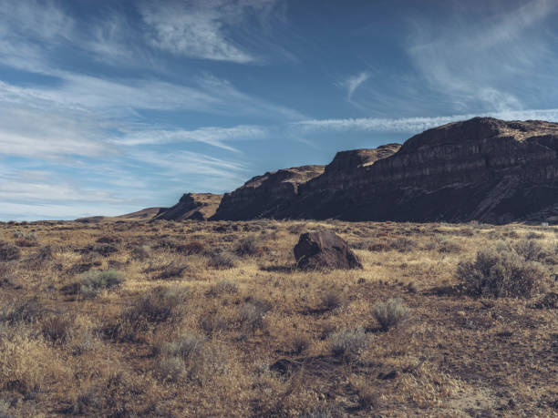 Factory Butte, massive ancient sandstone natural structure surrounding by incredible landscape in Hanksville, Utah.