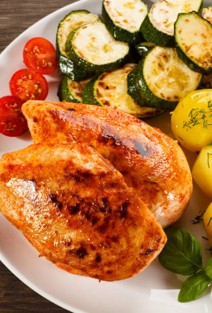 istock Grilled chicken breast and vegetables 820834732