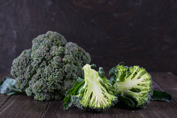 istock Fresh green garden broccoli on dark background 820838824