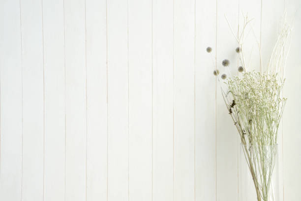 Dried flower on white wooden board