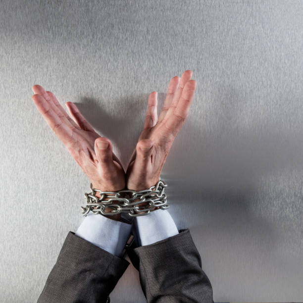 istock innocent professional man hands tied with chain for suspicious management 820843984