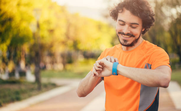istock Sportsman looking at his smart watch 820844396