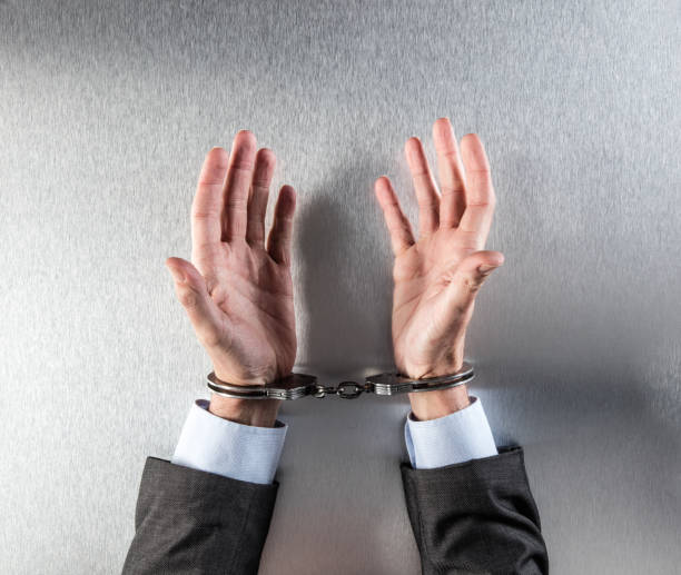 istock innocent businessman hands tied with handcuffs complaining or being hostage 820844706