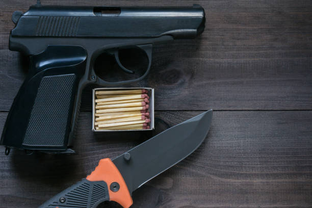 istock survival kit for tough man. gun, knife, matches 820844790