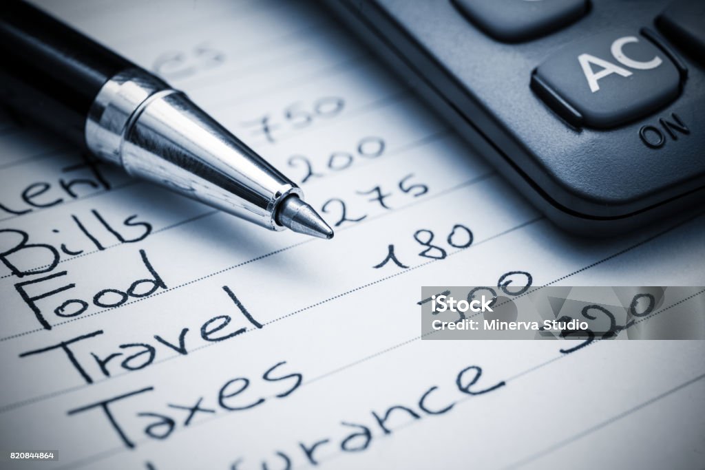 Household expenses concept Household expenses concept. Blue toned background Home Finances Stock Photo