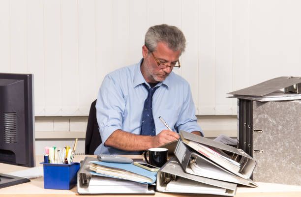 istock Businessman overstressed at his office desk 820850024
