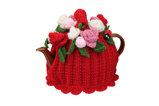 A Woollen Knitted Tea Cosy on a Teapot.