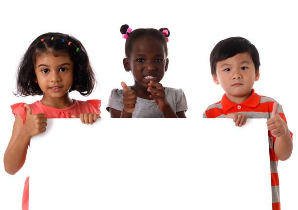 portrait three of multiracial kids in studio with white board.isolated - preschooler childhood outdoors cheerful imagens e fotografias de stock