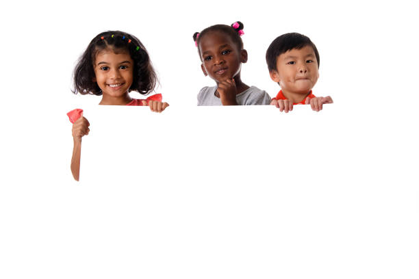 group of multiracial kids portrait with white board.isolated - preschooler childhood outdoors cheerful imagens e fotografias de stock