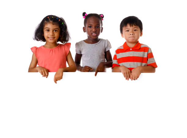 group of multiracial kids portrait with white board.isolated - preschooler childhood outdoors cheerful imagens e fotografias de stock