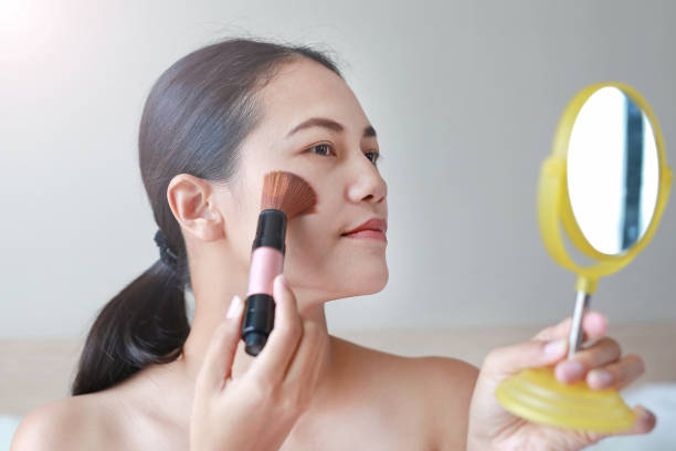 istock Beauty Girl with Makeup Brush. 820854260