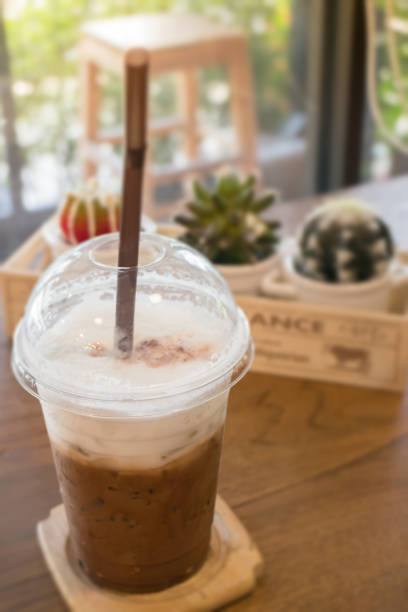 istock Iced coffee on wooden table 820857384