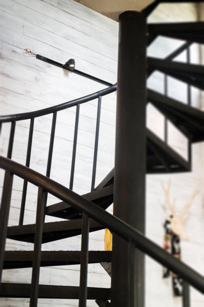 istock Dark iron metal spiral staircase 820857484