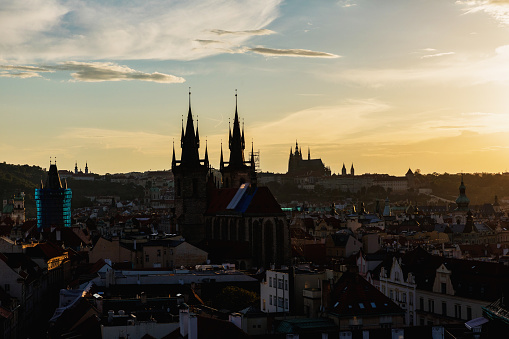 Prague, Czech Republic. View of Prague from the Powder Tower, panorama of towers and roofs over Prague. Silhouettes of towers and castle.