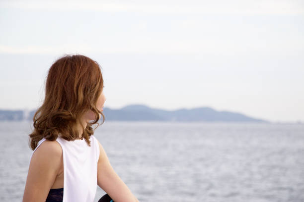 istock Woman is exercising yoga at seaside 820857902