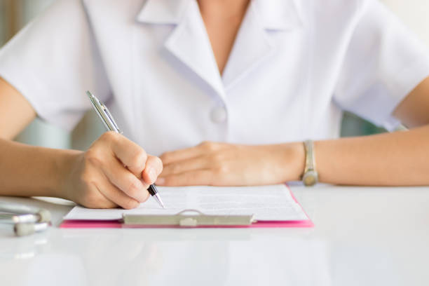 istock Nurse writing report in hospital 820858000