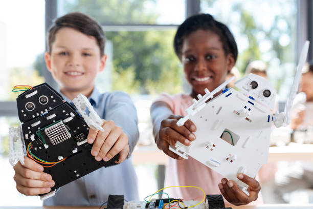 istock Children with robot models smiling at the camera 820859168