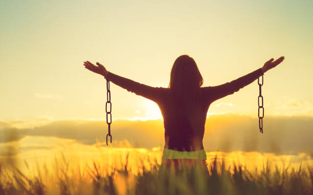 Woman feeling free in a beautiful natural setting. Woman feeling free in a beautiful natural setting. chain stock pictures, royalty-free photos & images