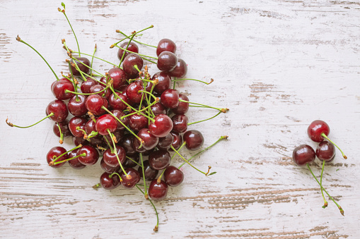 Cherries on wooden table.