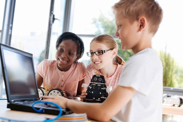 istock Fair-haired boy showing tutorial video to his friends 820863024