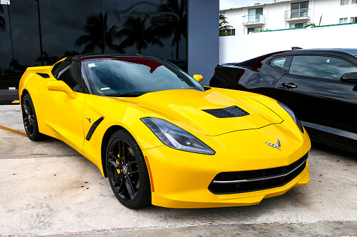 Cancun, Mexico - June 4, 2017: Yellow american sportscar Chevrolet Corvette in the city street.
