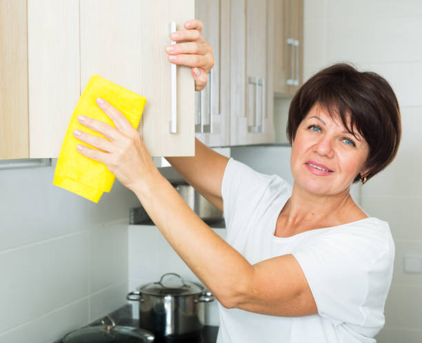 istock mature woman cleaning 820863766