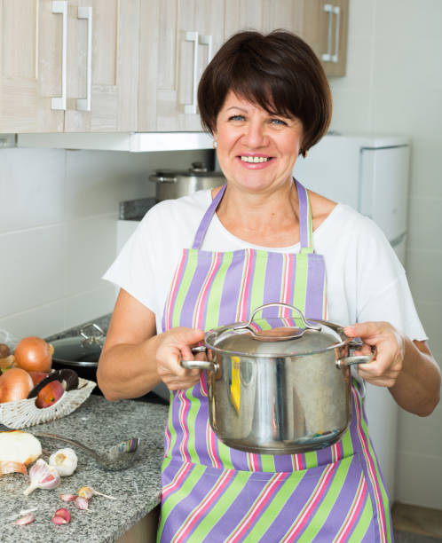 istock mature woman soup 820863800
