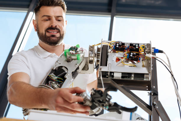 istock Handsome man trying out the performance of hand mechanism 820864302