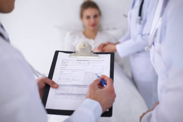 istock A group of doctors discussing medical history close up 820865244