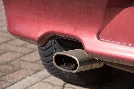 Exhaust of an Italian red car