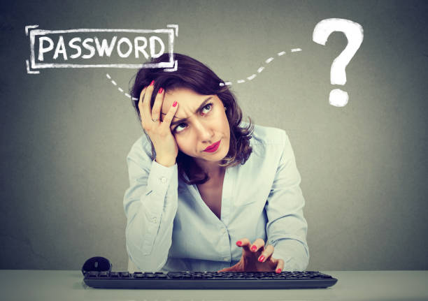 desperate young woman trying to log into her computer forgot password - password imagens e fotografias de stock