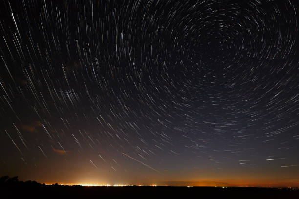 istock Night sky with bright stars trails. Astrophotography of outer space. 820867778